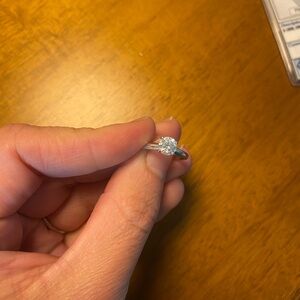 Traditional solitaire setting white gold diamond ring with paper work.